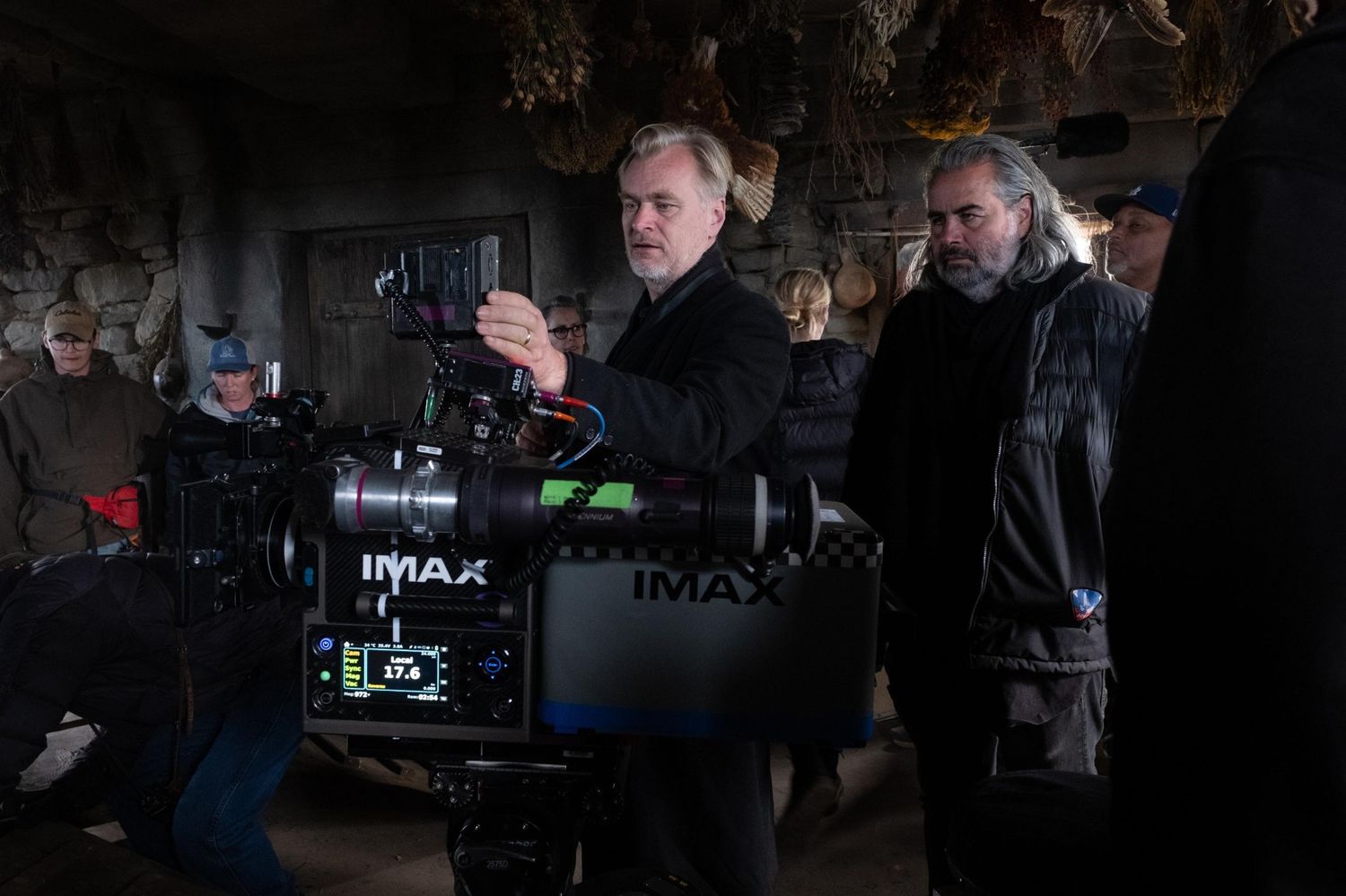 Christopher Nolan and cinematographer Hoyte van Hoytema working with an IMAX film camera behind the scenes of The Odyssey (2026)